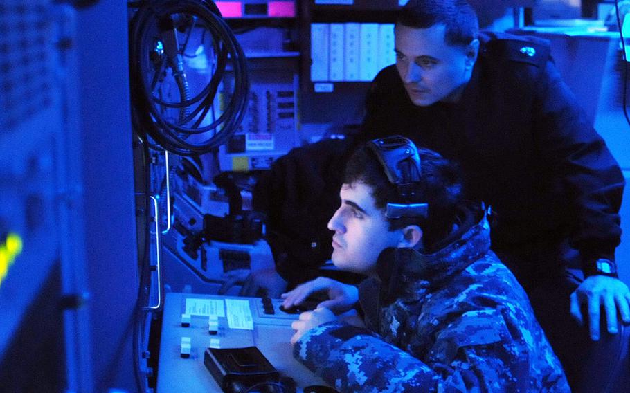Sailors aboard the USS Patriot operate an SQQ-32 sonar on March 15, 2012, during an exercise Foal Eagle 2012 mine-hunting training scenario.