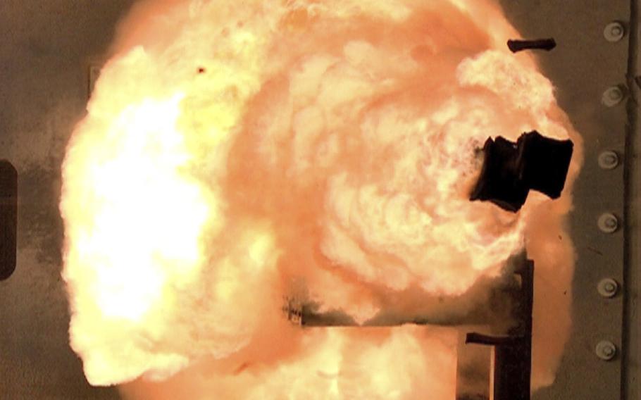 In this Feb. 24, 2012 photo provided by the U.S. Navy, a high-speed camera captures the first full-energy shots from an electromagnetic launcher at a test facility in Dahlgren, Va.