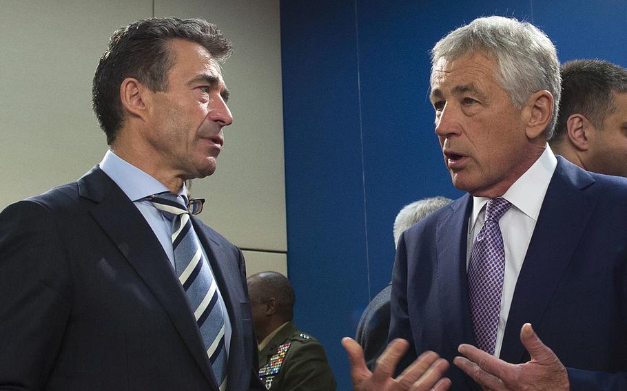 Secretary of Defense Chuck Hagel, right, speaks with NATO Secretary General Anders Fogh Rasmussen at NATO headquarters in Brussels, Belgium, on June 5, 2013.