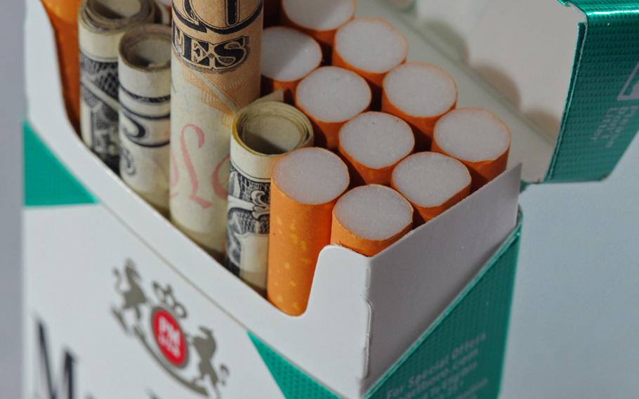 According to data available in April 2010, Americans spend each year more than $50 billion on cigarettes, essentially smoking their money away. Roughly 30% of military active duty personnel smoke, and the Department of Defense health care system spends roughly $930 million dollars on smoking-related illnesses. This photo won honorable mention as an illustrative in the 2011 Military Photographer of the Year competition.