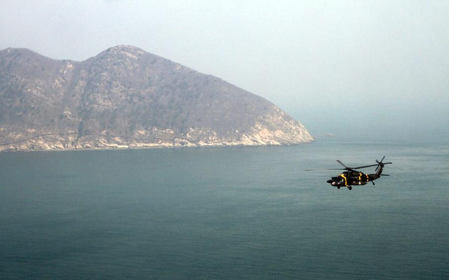 Command Sgt. Maj. John Troxell, United Nations Command, Combined Forces Command and U.S. Forces Korea, travels to the strategically important island of Baengnyeong, South Korea, on March 13-14, 2014, with several top South Korean military advisers. A flashpoint in relations between the Koreas, the island was near the site of the sinking of the South Korean naval vessel Cheonan on March 26, 2010, killing 46 sailors.