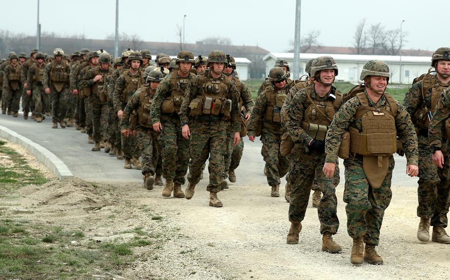 Marines and sailors with Weapons Company, 3rd Battalion, 8th Marine Regiment, 2nd Marine Division assigned to Black Sea Rotational Force 14 hike around the perimeter of Mihail Kogalniceanu Air Base, Romania March 28, 2014.