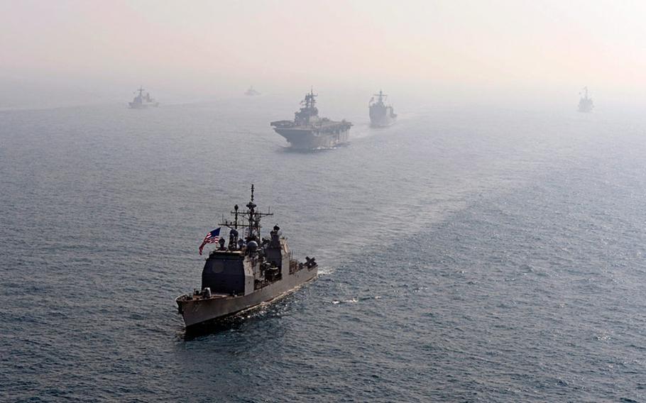The guided missile cruiser USS Lake Erie, foreground, transits the East China Sea with ships assigned to the Bonhomme Richard Amphibious Ready Group and Republic of Korea navy ships during a photo exercise March 27, 2014. The Lake Erie was participating in the Ssang Yong 14 exercise with South Korea.
