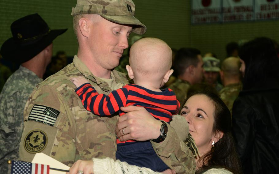 U.S. Army soldiers assigned to 2d Cavalry Regiment return home and greet their families, friends and fellow soldiers at Vilseck, Germany, after coming back from their deployment on Jan. 22, 2014.
                Leaders of the Dragoon Ready Reserve, battle buddies whom have already returned home and families greet the incoming troops with hugs, kisses and a message of a job well done.