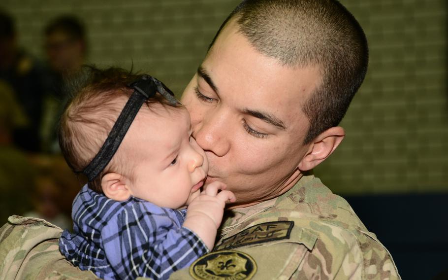 U.S. Army soldiers assigned to 2nd Cavalry Regiment return home and greet their families, friends and fellow soldiers at Vilseck, Germany, after coming back from their deployment on Jan. 22, 2014.
