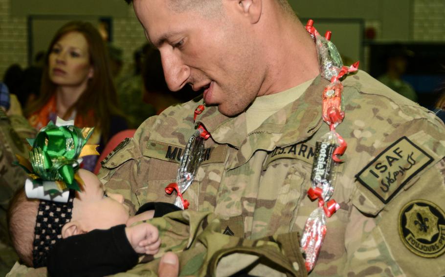 U.S. Army soldiers assigned to 2nd Cavalry Regiment return home and greet their families, friends and fellow soldiers at Vilseck, Germany, after coming back from their deployment on Jan. 22, 2014.