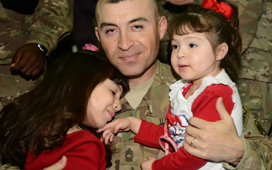 U.S. Army soldiers assigned to 2nd Cavalry Regiment return home and greet their families, friends and fellow soldiers at Vilseck, Germany, after coming back from their deployment on Jan. 22, 2014.
                