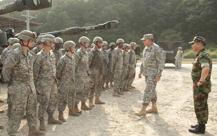 U.S. Army Gen. James D. Thurman, second from right, and Republic of Korea (ROK) Army Gen. Jung Seung-jo speak to troops following a live-fire exercise at Rodriguez Range in the ROK Sept. 1, 2011. 