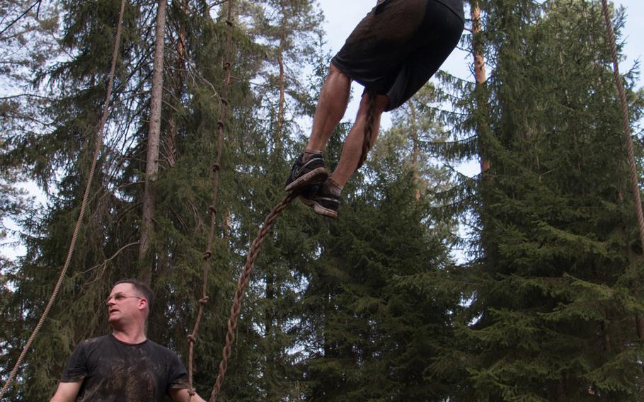 Runners climb the final major obstacle at the Grafenwšhr Rugged Terrain Obstacle Course at USAG Grafenwöhr, April 12, 2014. 