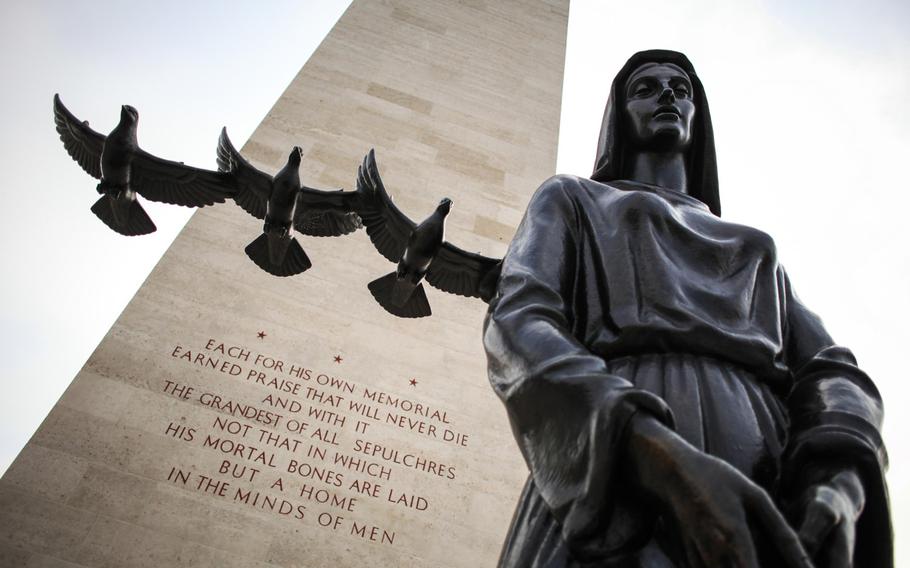 A statue stands before the chapel at the Netherlands American Cemetery and Memorial in Margraten, Netherlands, where 8,301 American dead from World War II are buried.