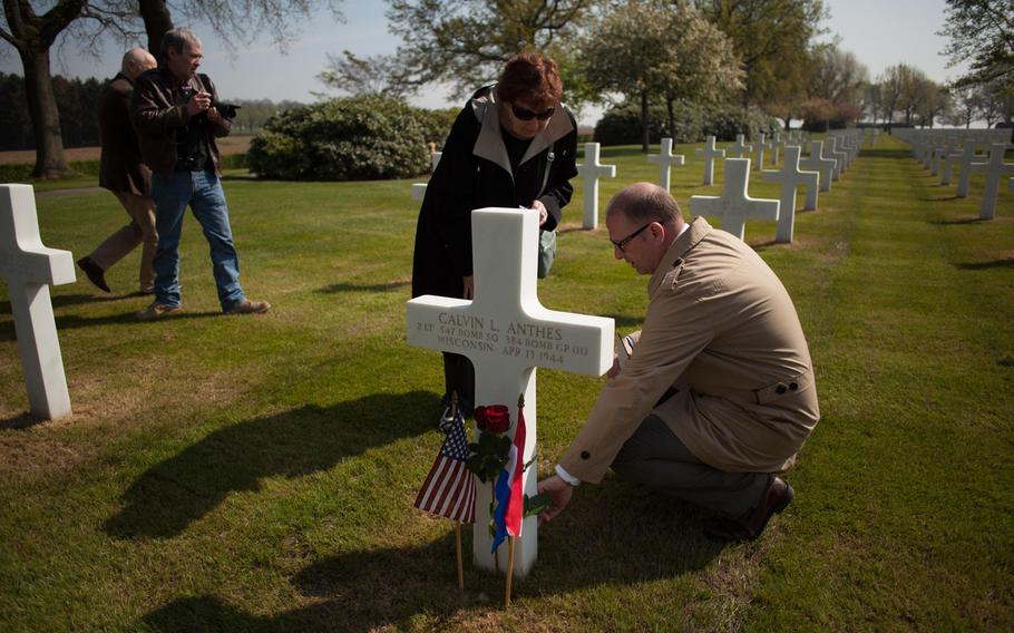 Richard Arsenault, assistant superintendent of the Netherlands American Cemetery and Memorial in Margraten, Netherlands, explains the markings on the headstone of Calvin Anthes to his daughter, Lois O'Keefe, who was born a day after her father died. Anthes and five other airmen died April 13, 1944, after their B-17 bomber was hit by German flak guns and crashed in Fouleng, Belgium.