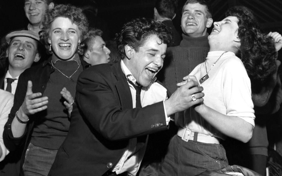 The audience at a performance by Bill Haley and His Comets at Strasbourg, France, in November, 1958.
                