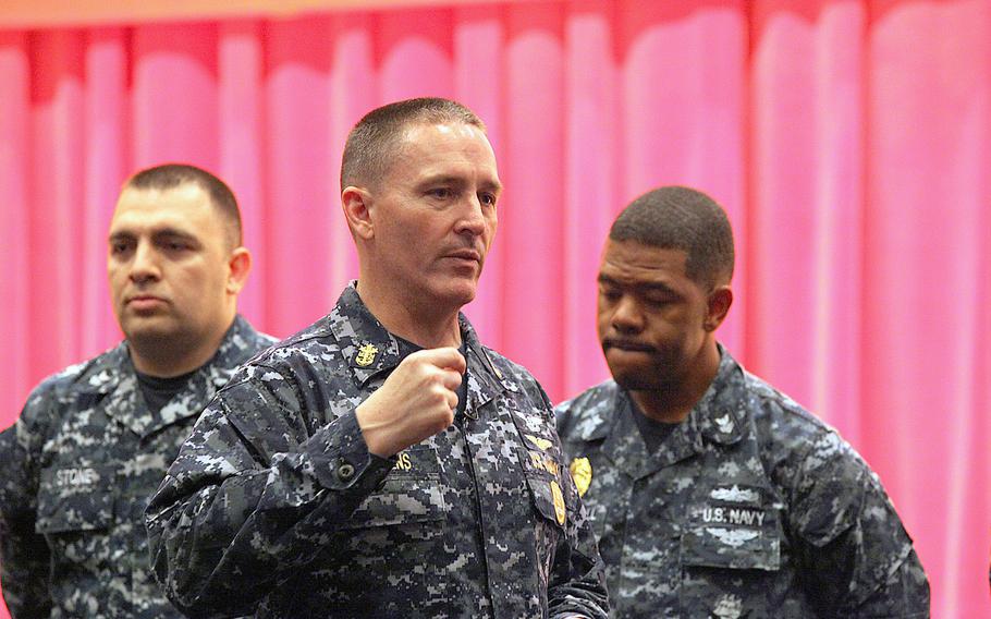 Master Chief Petty Officer of the Navy Michael D. Stevens speaks to sailors at an all-hands call at Yokosuka Naval Base April 23. Here, Stevens invited volunteers to help him illustrate the balanced nature of the Navy's future.