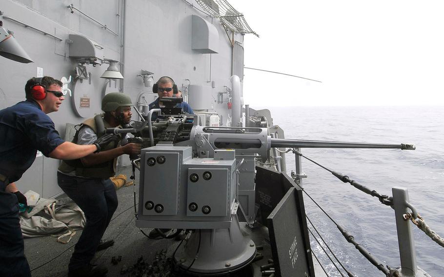 Sailors aboard the USS Taylor fire an MK-38 25mm machine gun during a weapons exercise while operating in the Mediterranean Sea on June 15, 2010. The guided missile frigate entered the Black Sea on Tuesday, April 22, 2014, to promote peace and stability in the region, the Navy said.