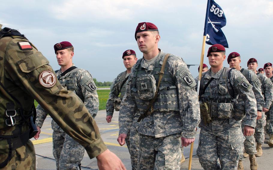 Paratroopers from U.S. Army Europe's 173rd Infantry Brigade Combat Team (Airborne) stand in formation with their partners from the Polish army's 6th Airborne Brigade, on April 23, 2014, at the start of a training rotation with Polish forces. 