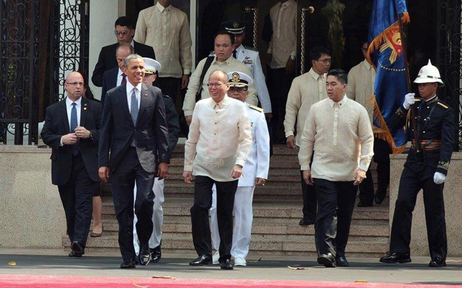 U.S. President Barack Obama and Philippine President Benigno Aquino III walk during the arrival ceremony at the Malacañan Palace in Manila, Philippines, on Monday, April 28, 2014.