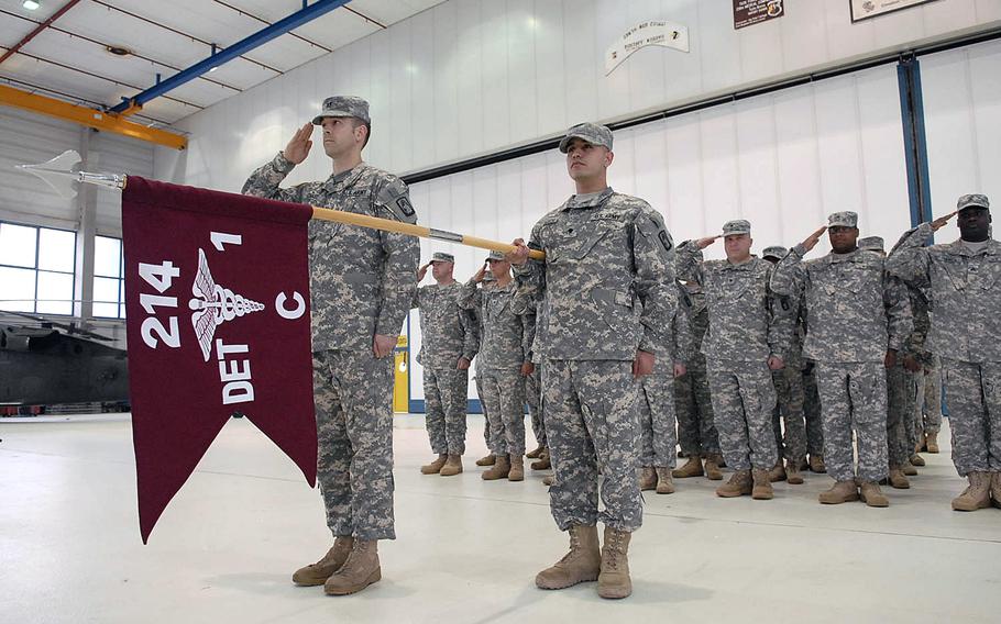 Soldiers with Company C, 1st Battalion, 214th Aviation Regiment stand in formation during a deployment ceremony Wednesday, April. 30, 2014, at Landstuhl Army Heliport in Germany. About 40 of the company's soldiers are deploying to Kuwait, where they'll provide air medical evacuation.