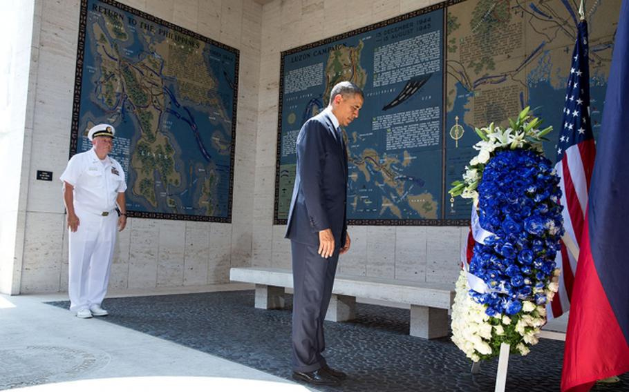 President Barack Obama participates in a wreath laying ceremony at the Manila American Cemetery, Philippines, April 29, 2014.