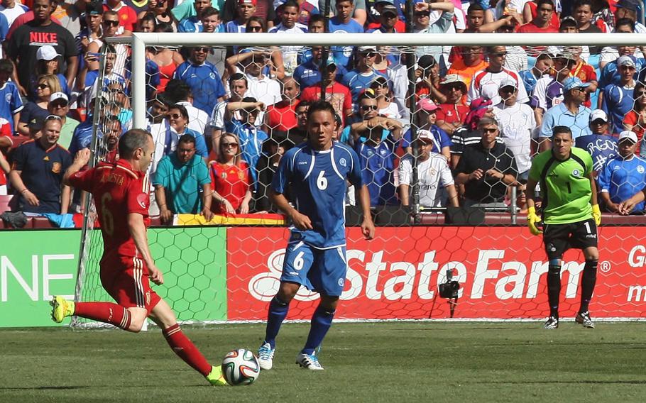 Spain's Andres Inieista cranks off a shot past El Salvador defender Richard Menjivar (6) toward goalkeeperr Henry Hernandez during a pre-World Cup friendly at FedEx Field in Landover, Md., on Saturday, June 7, 2014. Spain won 2-0.