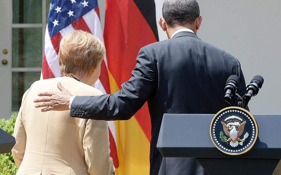 German Chancellor Angela Merkel and President Barack Obama leave the Rose Garden of the White House after speaking on Friday, May 2, 2014.