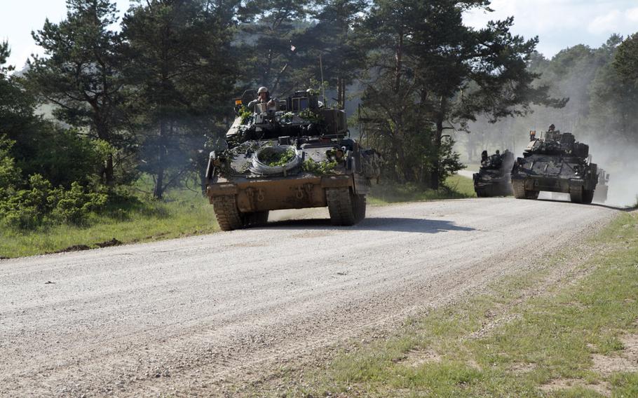 U.S. Soldiers from 1st Brigade, 1st Cavalry Division travel in a Bradley Fighting Vehicles during Combined Resolve II on May 24, 2014.