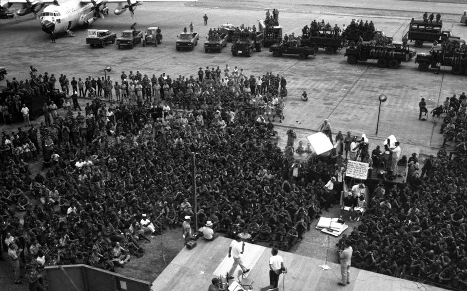 Bob Hope struts onstage carrying a parasol during a show in Southeast Asia in 1965.