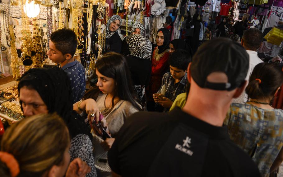 The souq, a traditional market, near the Irbil Citadel in the center of the capital of Iraqi Kurdsitanl bustles with shoppers on Monday, Aug. 25, 2014.
                
