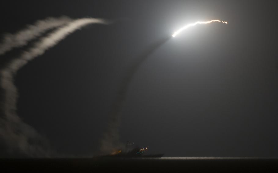 The guided-missile cruiser USS Philippine Sea launches a Tomahawk cruise missile as seen from the aircraft carrier USS George H.W. Bush on Sept. 23, 2014 as the U.S. carried out strikes against the Islamic State in Syria.