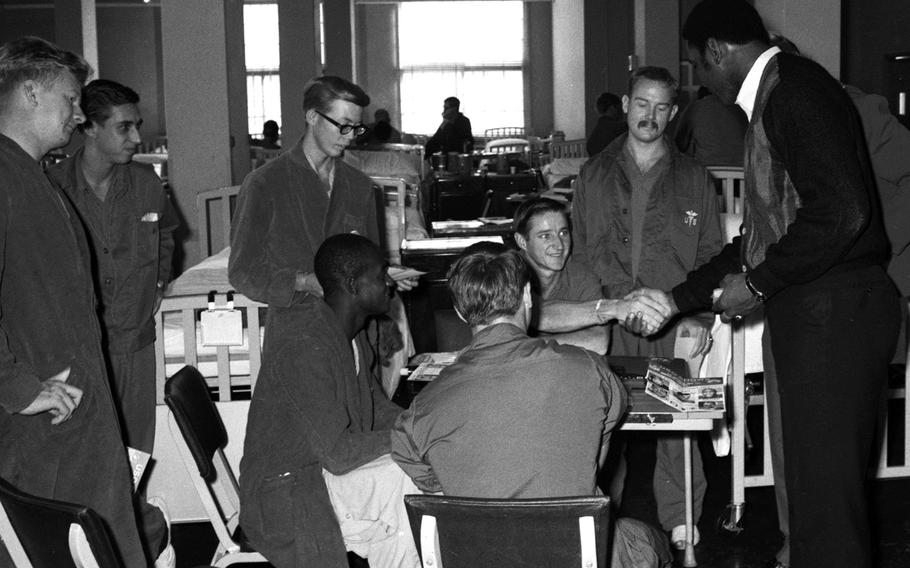 Marv Fleming talks with troops at the U.S. Army Hospital on Camp Oji, Japan, in January, 1969.