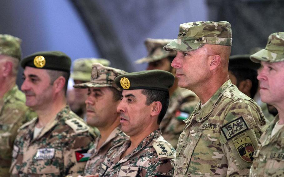 U.S. Army Lt. Gen. Joseph Anderson, right, commander of the International Security Assistance Force Joint Command and 18th Airborne Corps, stands next to Jordanian army Col. Mohammad Al-khraisha during the Jordan armed forces transfer-of-authority ceremony at Bagram Air Field, Afghanistan, on June 25, 2014.