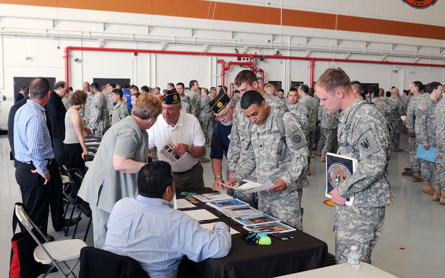 U.S. Army Reserve soldiers attending attend a job fair at Joint Base McGuire-Dix-Lakehurst in July 2014. The event featured dozens of local employers seeking veterans and eligible military spouses to fill their positions.