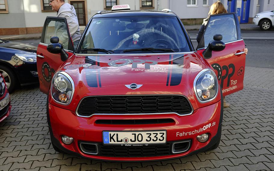 An instructor with the Opp driving school, left, and a student, right, finish training Thursday, Jan. 15, 2015, in Kaiserlautern, Germany. The U.S. and Germany are in dispute over whether a USAREUR license is valid if the bearer's U.S. state license has expired. Getting a German license may not be an option.
