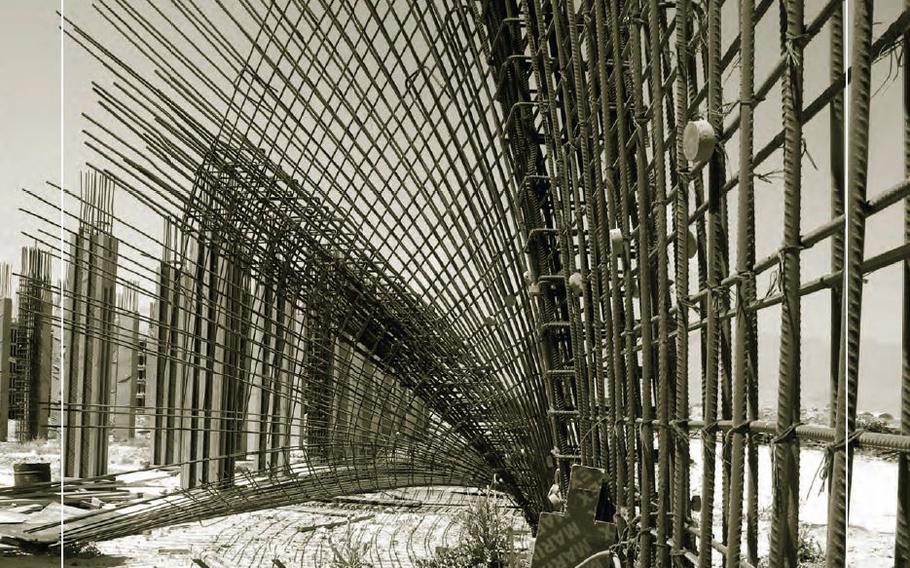 Cover photo for SIGAR's July 2013 quarterly report shows tilted columns and sagging reinforcing rods at the Justice Center Court House construction project in Parwan Province, Afghanistan, where SIGAR was launching an examination of the project.