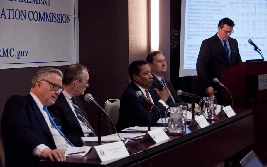 Alphonso Maldon, Jr., chairman of the Military Compensation and Retirement Modernization Commission (center), speaks at a Jan. 29, 2015 press conference in Arlington, Va., revealing changes to pensions, health care and other troop benefits following its two-year review.