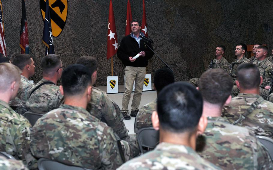 Secretary of Defense Ashton Carter speaks to airmen and soldiers during a visit to Kandahar Airfield, Afghanistan Feb. 22, 2015. Having sworn in only five days prior, the trip was Carter's first official visit to Afghanistan as defense secretary.