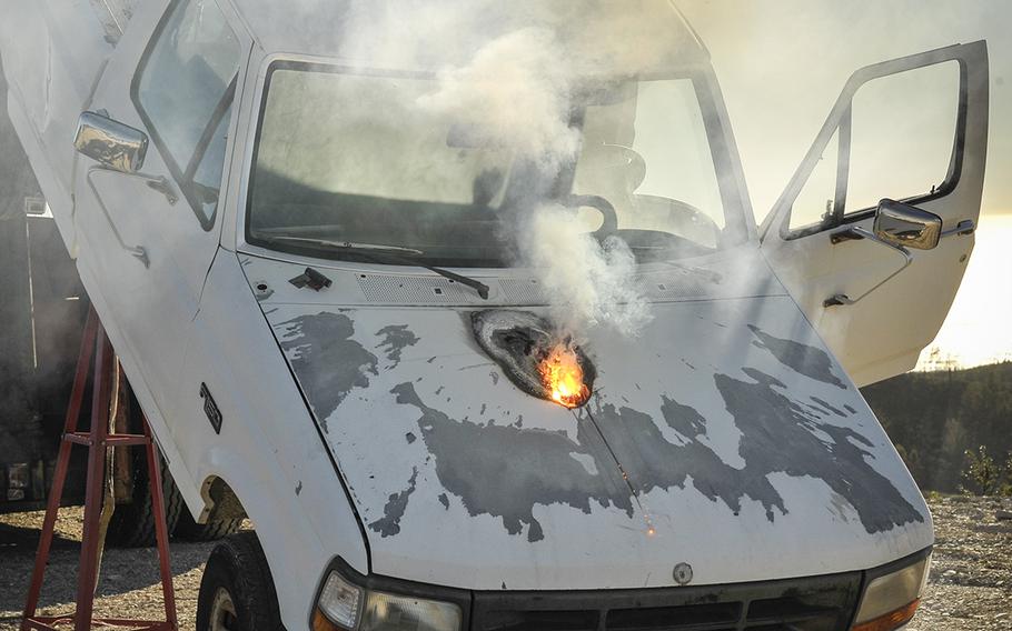 Lockheed Martin ATHENA laser weapon system defeats a truck target by disabling the engine, demonstrating its military effectiveness against enemy ground vehicles.