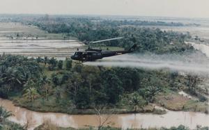 24p cs
U.S. Army
A U.S. military helicopter sprays Agent Orange over Vietnam in this undated photo from the war.