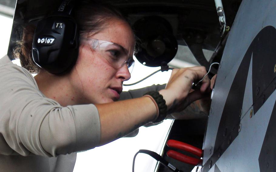 U.S. Air Force Staff Sgt. Nicole Moss, assigned to the 127th Wing, Michigan Air National Guard, performs routine maintenance on an A-10 Thunderbolt II aircraft at Selfridge Air National Guard Base, Mich., Aug. 29, 2013.