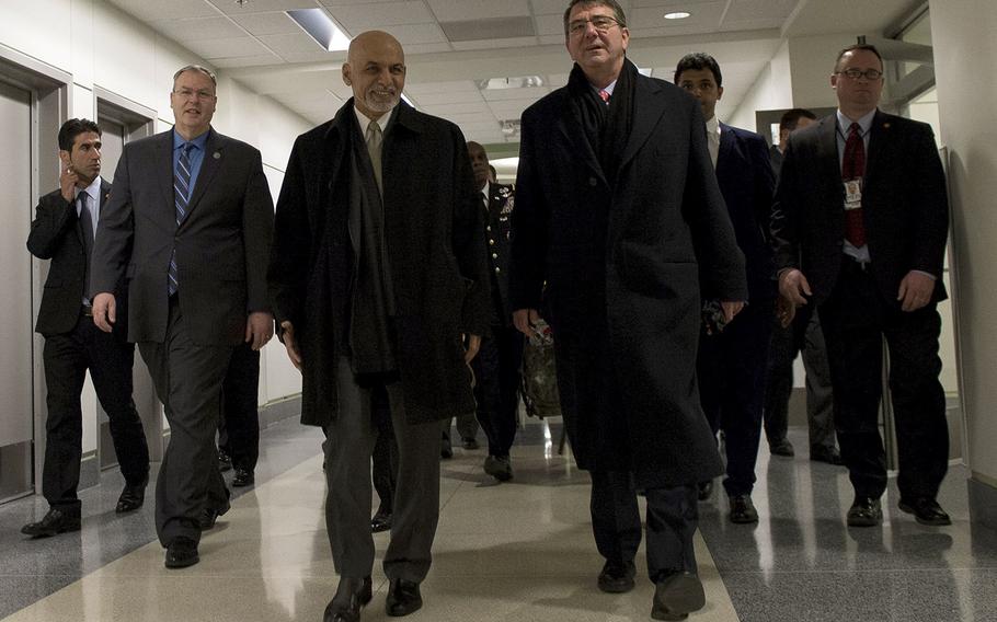 Secretary of Defense Ash Carter walks with Afghan President Ashraf Ghani at the Pentagon, March 23, 2015.