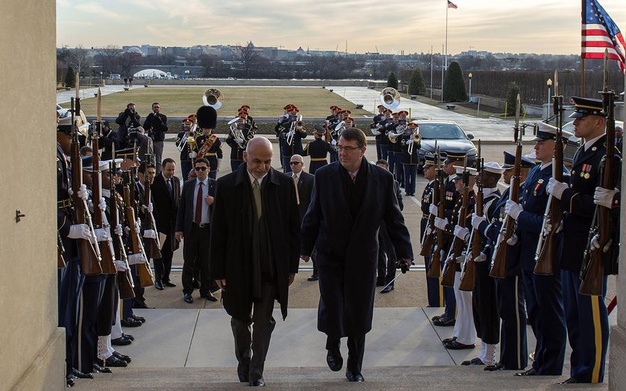 Secretary of Defense Ash Carter walks up the steps to the Pentagon with Afghan President Ashraf Ghani, March 23, 2015.