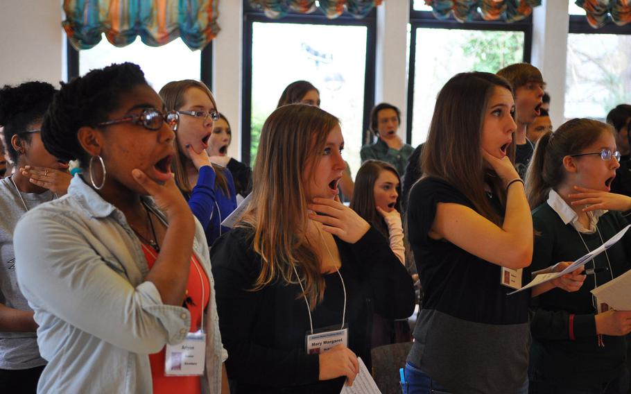 Vilseck's Crystal Morris, from left, Alconbury's Mary Margaret McKillop, Patch's Chesney Walters and Ankara's Abigail Hansen practice a singing technique during rehearsals Tuesday at the annual DODDS-Europe Honors Music Festival in Oberwesel, Germany.