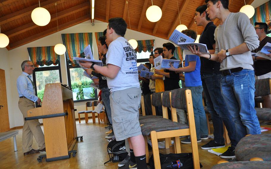Guest choral conductor Mark Babcock leads the choir in rehearsals on Tuesday, March 24, 2015, at the annual DODDS-Europe Honors Music Festival.