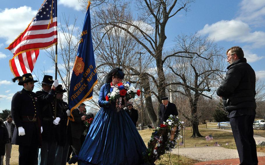 An honor guard of the Gettysburg Blues, Sons of Union Veterans of the Civil War, stand at attention Saturday as wreaths are laid in ceremonies honoring 20 Union soldiers awarded the Medal of Honor for heroism at the Battle of Antietam. The Union victory enabled President Abraham Lincoln to issue the Emancipation Proclamation, paving way for the end of slavery in the United States.