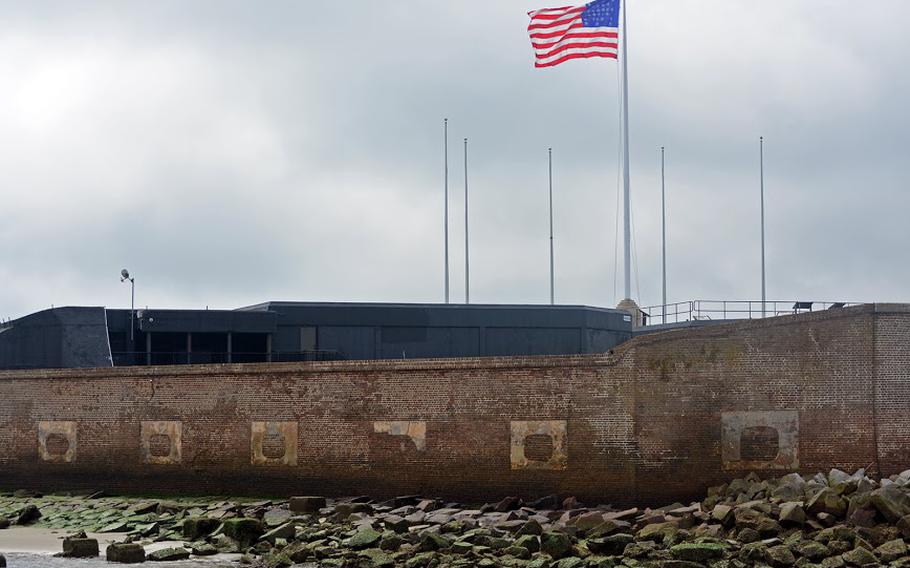 Fort Sumter as seen from the ferry, with the flag raised above the fort.