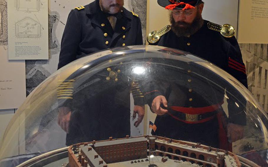Two re-enactors describe where enlisted men slept to visitors at Fort Sumter on April 14, 2015, the 150th anniversary of the re-raising over the flag over Fort Sumter.