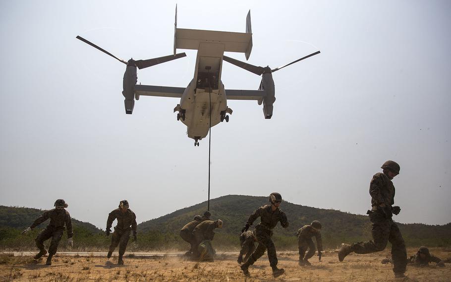 U.S. Marines evacuate the area as an MV-22B Osprey prepares to land at Hat Yao, Thailand, in February during Exercise Cobra Gold 2014.
