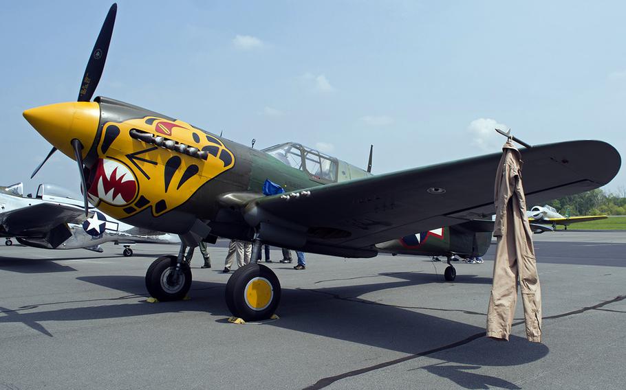 A flight suit hangs off the wing of a plane at the Culpeper Regional Airport Thursday, May 7, during the preview for the Arsenal of Democracy: World War II Victory Capitol Flyover.