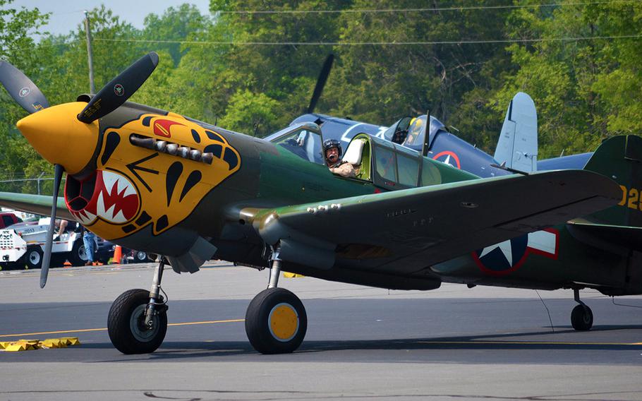 A pilot smiles after landing his plane at the Culpeper Regional Airport Thursday, May 7, during the preview for the Arsenal of Democracy: World WA maar II Victory Capitol Flyover.