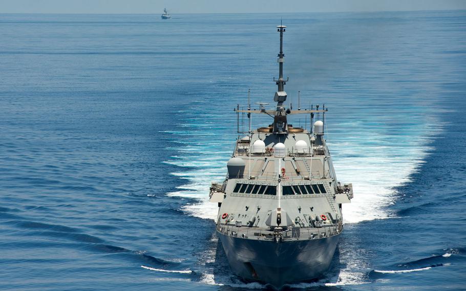 The littoral combat ship USS Fort Worth conducts patrols in international waters of the South China Sea near the Spratly Islands as the Chinese guided-missile frigate Yancheng transits close behind May 11, 2015.
