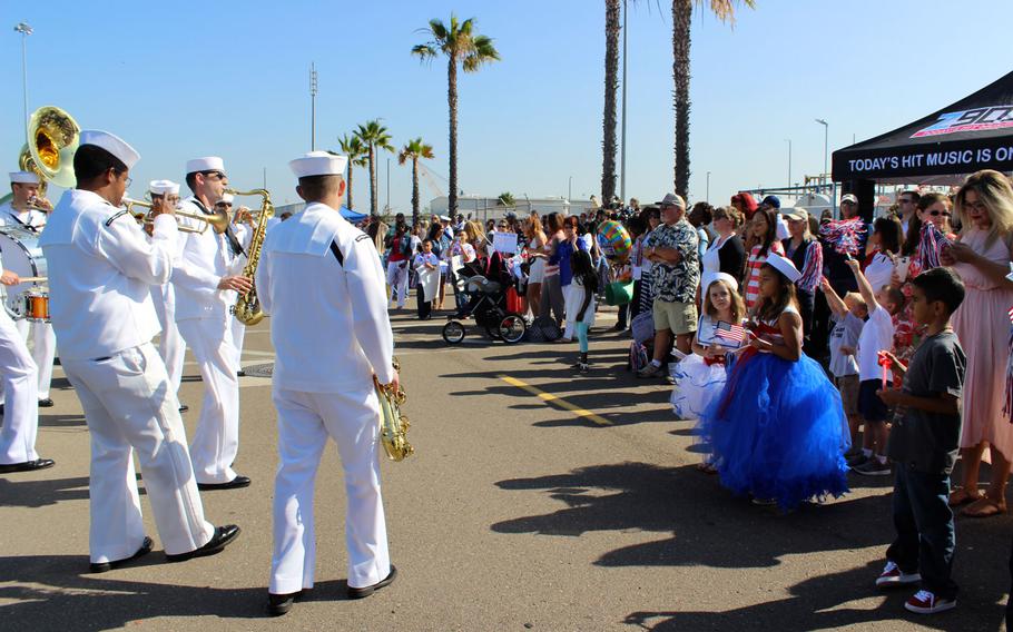 A Navy jazz band entertains families at Naval Base San Diego on Monday, June 1, 2015, as they wait for the USS Sampson to pull up to the pier. The guided-missile destroyer was deployed for 7 months to the Asia-Pacific region.
